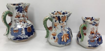 A graduated set of three Mason's ironstone Japan pattern "hydra" jugs, largest 13.