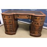 A late Victorian mahogany breakfront double pedestal desk,