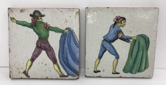 A pair of Ceramica Navia of Seville terracotta tiles polychrome decorated with bullfighters 14 cm