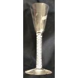 An 18th Century ale flute, the conical bowl on a double enamel twist stem to circular foot 18.