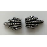 A pair of early 20th Century Belle Epoque period diamond mounted collar clips of foliate design