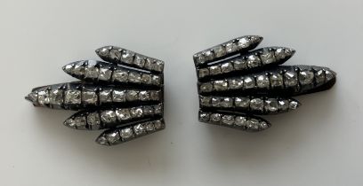 A pair of early 20th Century Belle Epoque period diamond mounted collar clips of foliate design