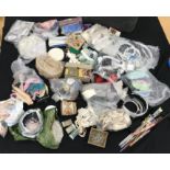 A box containing a quantity of haberdashery of various ages to include elastic bias binding,