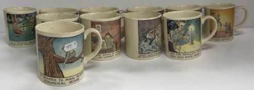 A collection of eleven Poole pottery mugs by Glen Baxter,