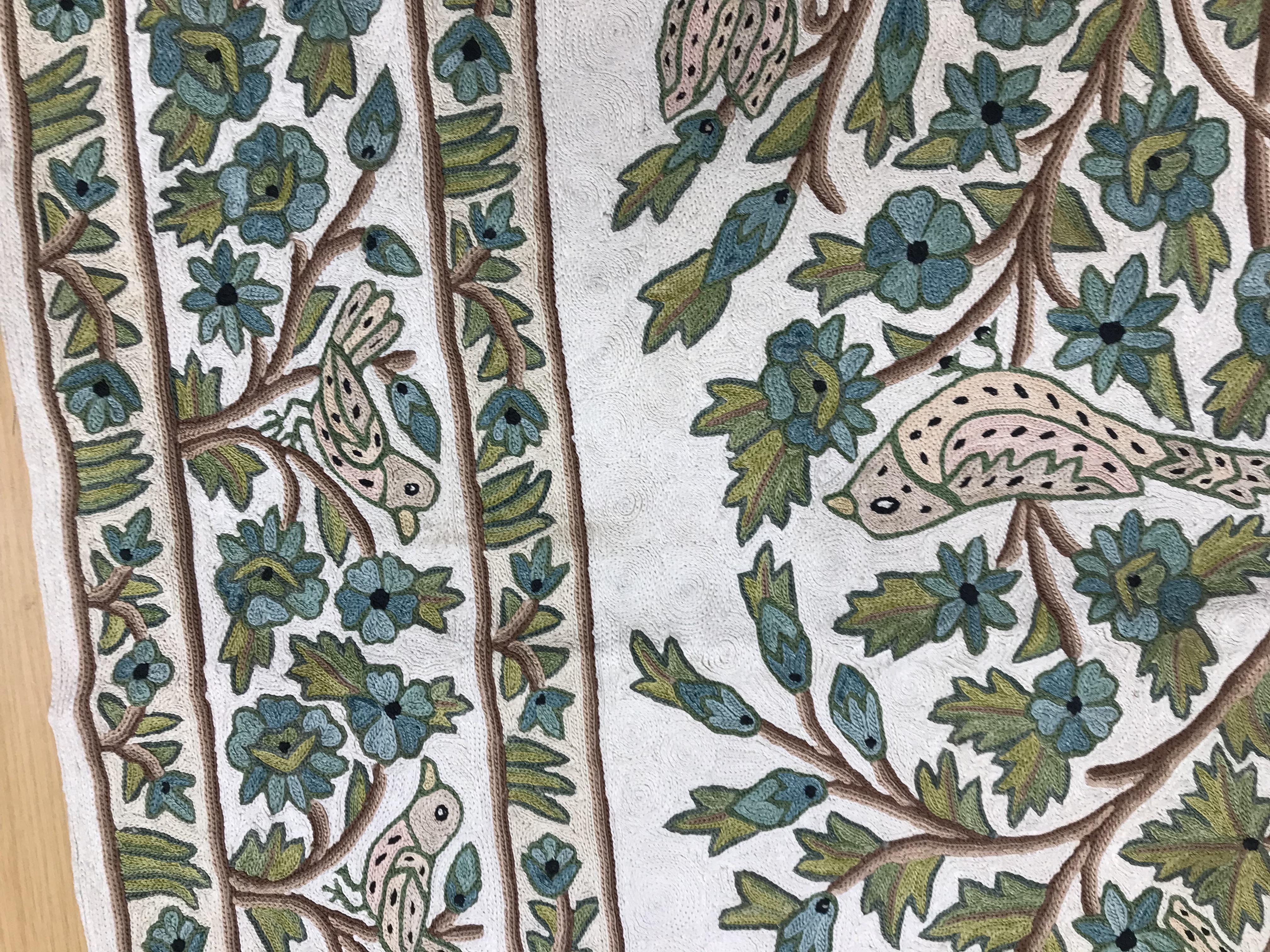 A crewel work panel depicting tree and birds in blue and teal on a cream and blue ground, - Image 6 of 16