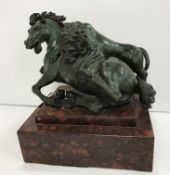 AFTER GIAMBOLOGNA OR ANTONIO SUSINI a 19th Century verdigris patinated bronze study of a lion