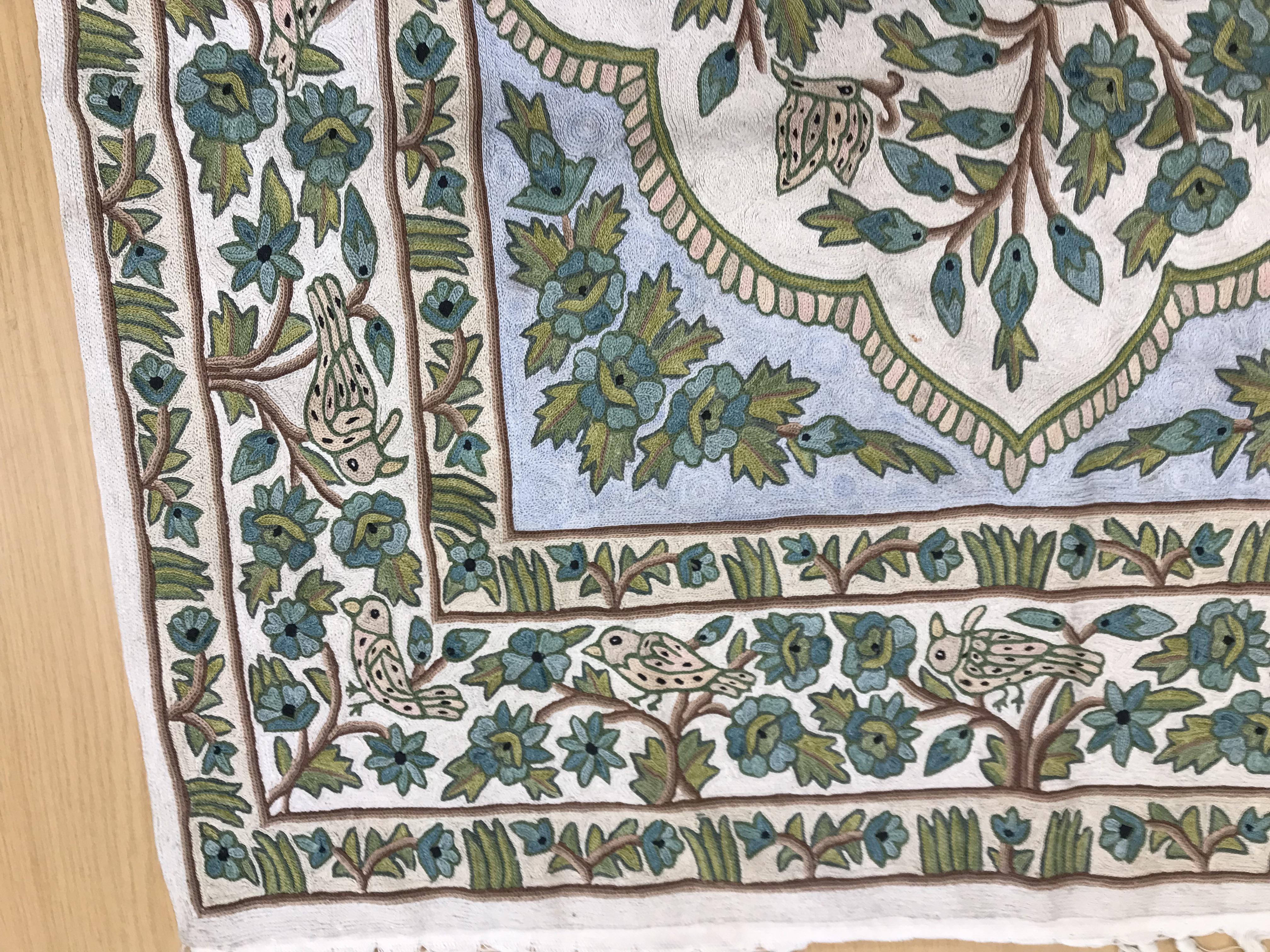 A crewel work panel depicting tree and birds in blue and teal on a cream and blue ground, - Image 13 of 16