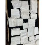 A box containing a collection of vintage household textiles to include lace edged and other table