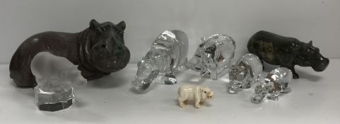 A collection of decorative hippos to include two Baccarat glass models, an Orrefors model,