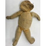 A dark gold plush wood wool filled bear of small proportions with hump back (unnamed) 27 cm long