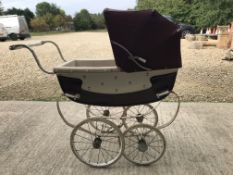 A Wilson pram with cream body and brown covers together with a child's vintage Silver Cross toy