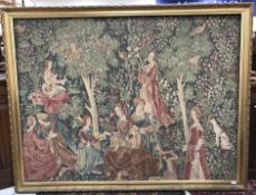 A large machine woven tapestry in the 17th Century manner depicting "Couples in a garden amongst