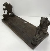 A Black Forest carved treenware folding telescopic book stand,