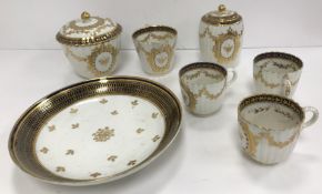 A Worcester Salopian blue and gilt decorated ribbed sugar box, cream jug, slop bowl, three tea cups,