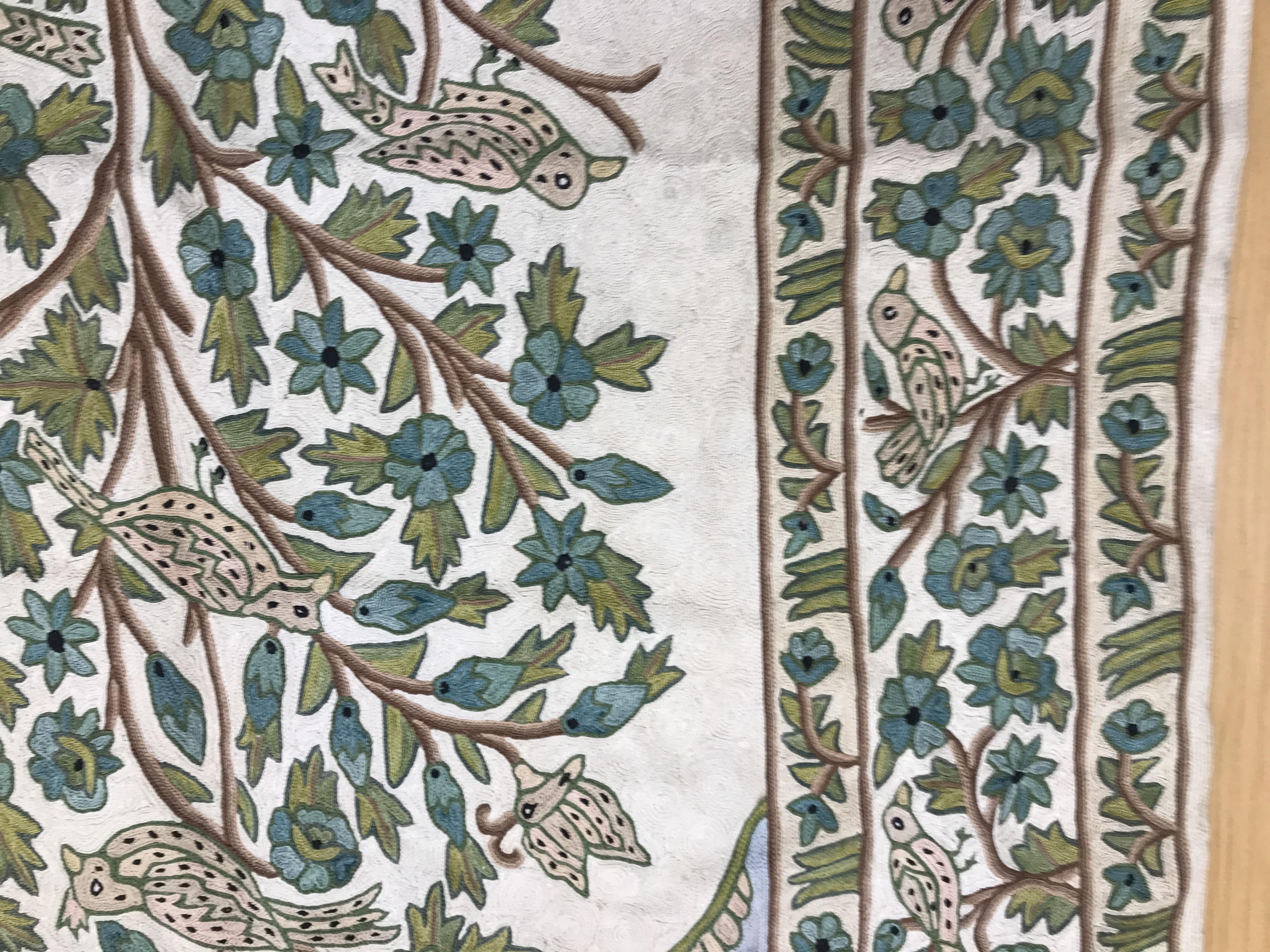 A crewel work panel depicting tree and birds in blue and teal on a cream and blue ground, - Image 8 of 16
