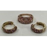 A 9 carat gold dress ring size L set with two bands of pink sapphires 3.