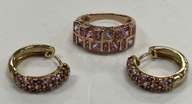 A 9 carat gold dress ring size L set with two bands of pink sapphires 3.