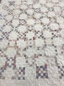 Three circa 1900 quilts comprising one hand-stitched patchwork quilt with white ground and