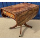 A late Regency mahogany Pembroke table, the cross-banded drop-leaf top with two end drawers,