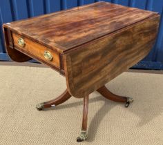 A late Regency mahogany Pembroke table, the cross-banded drop-leaf top with two end drawers,