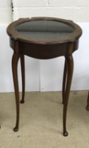 An Edwardian mahogany bijouterie table of circular form,