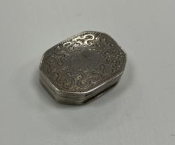 A George III silver vinaigrette of elongated octagonal form with wriggle work decorated lid opening