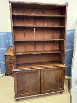 A 19th Century mahogany bookcase cabinet, the three quarter galleried top over five shelves,