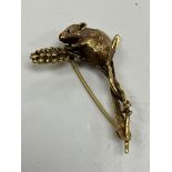 A 9 carat gold fieldmouse and wheat ear brooch 4.5 cm long, 7.