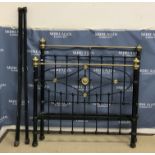 A late Victorian brass and iron three quarter bed stead with embossed roundel decoration to the