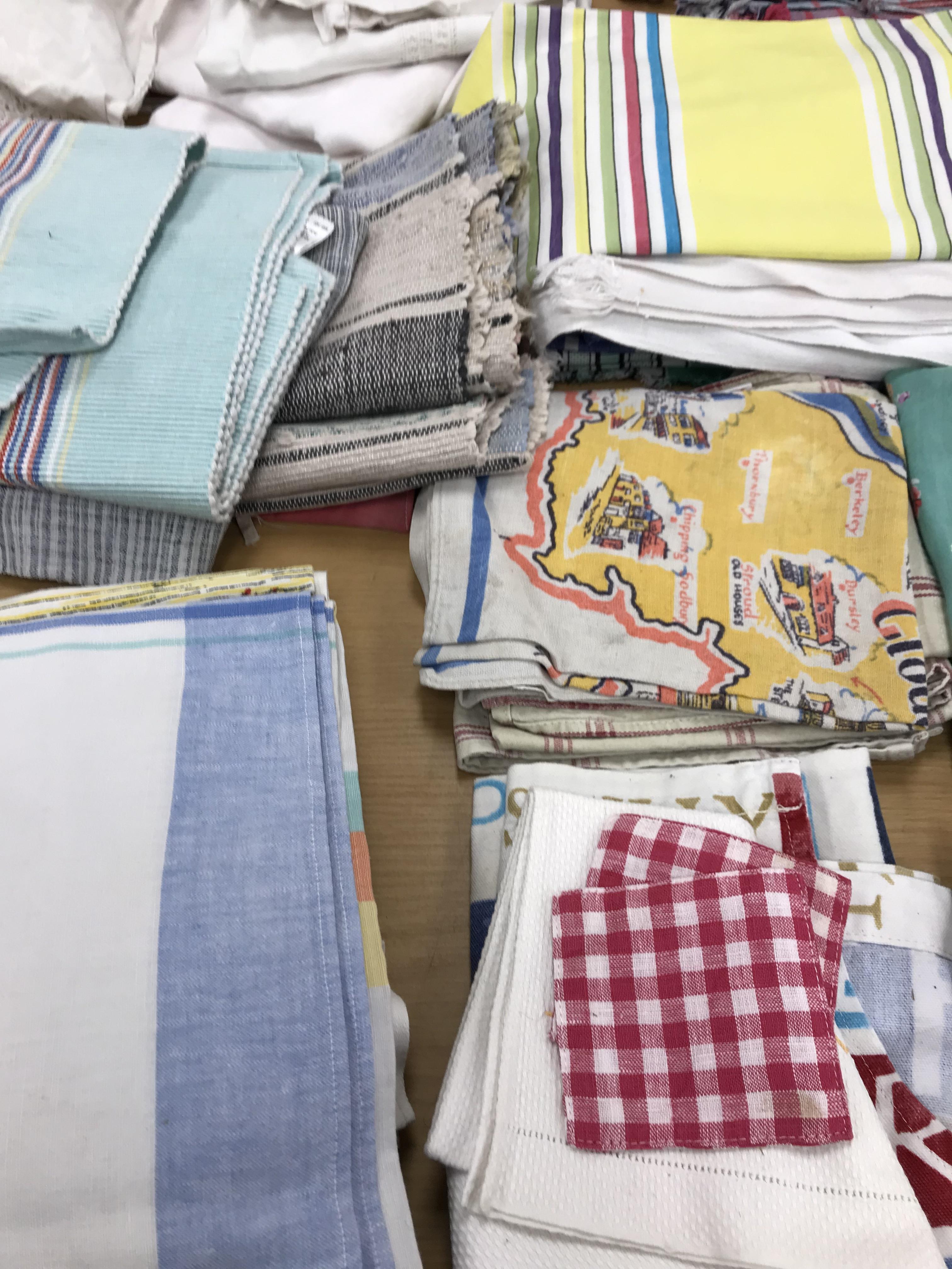 Two boxes of mainly household textiles to include vintage tablecloths, tea towels, aprons, etc. - Image 4 of 8