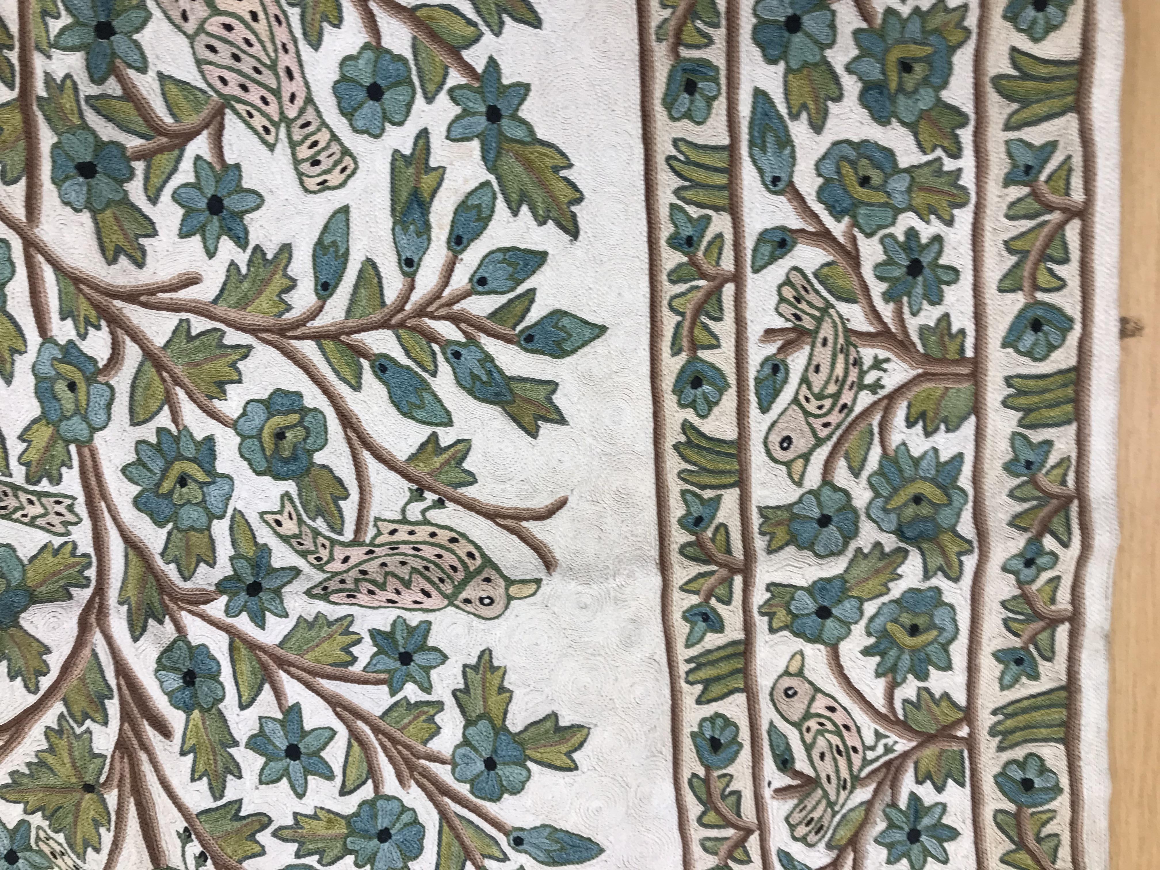 A crewel work panel depicting tree and birds in blue and teal on a cream and blue ground, - Image 7 of 16
