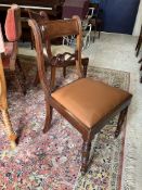 A set of seven Victorian mahogany bar back dining chairs with drop-in seats on turned and ringed