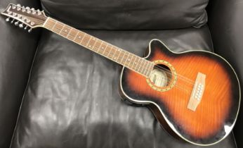 An Ashton SL29/12CEQTSB twelve string electro acoustic guitar with dark sunburst body,