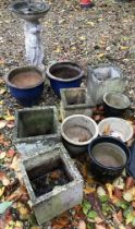A collection of garden pots to include a pair of blue glazed pots,