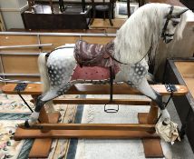 A late 19th Century Ayres grey dappled rocking horse on pillar stand,