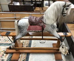A late 19th Century Ayres grey dappled rocking horse on pillar stand,