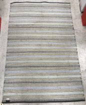 A striped Habitat rug in grey and yellow approx.