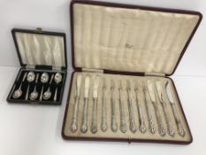 A cased set of six silver handled tea knives and forks with Arts & Crafts style knot decoration (by