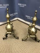 A pair of late Victorian brass fire dogs with relief decorated sphere and column decoration 52 cm