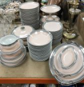 A Limoges pink and silver banded dinner service comprising 37 plates (23 cm), 20 plates (19.