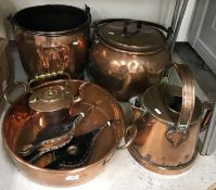 A collection of copper and copper wares comprising a large copper cauldron with lid,