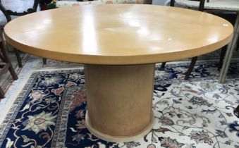 A Skovby of Denmark extending circular dining table on plain circular centre pedestal,