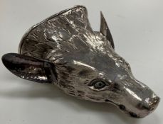 A Georgian embossed and engraved silver (unmarked) fox mask stirrup cup with inscription "This cup
