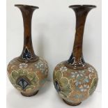 A pair of Doulton Slaters lace work and flower head relief decorated slender necked vases with