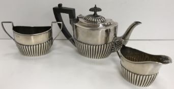 A Victorian silver miniature tea pot with semi reeded decoration (by Charles Boyton,