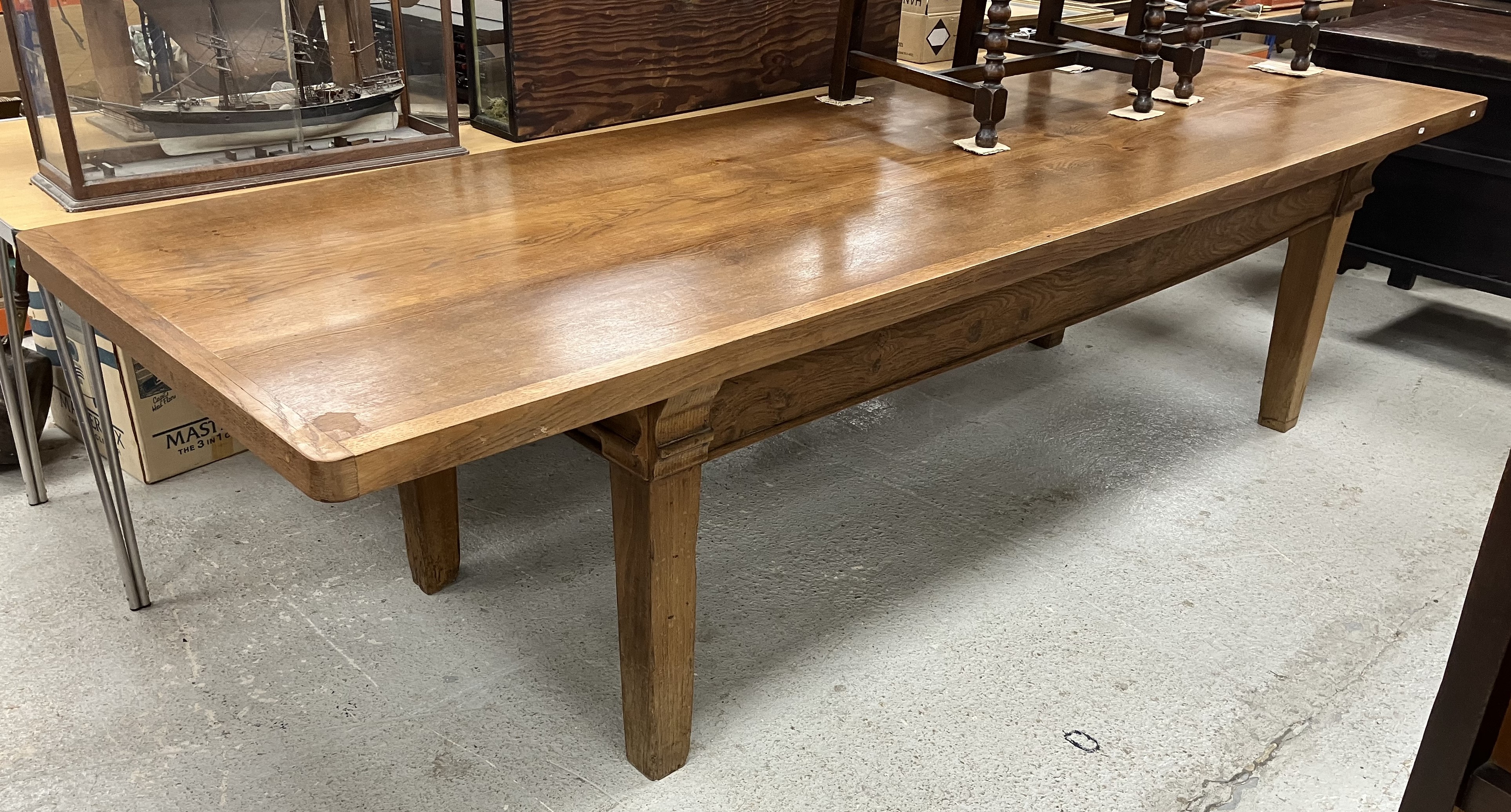 An oak dining table in the 19th Century French taste,