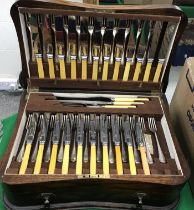 An oak cased canteen of cutlery by Meaders Ltd of Boscombe and Price & Co.