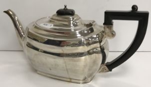 A George VI silver tea pot of canted rectangular bellied form with ebonised handle (by S