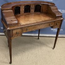 A mahogany Carlton House desk in the Georgian style with fitted super structure of small drawers,