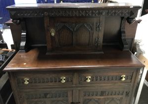 A mid 20th Century oak court cupboard in the 17th Century style,